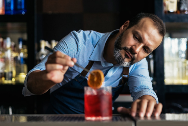 Bartender with a drink